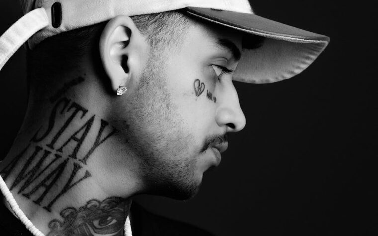 Zayn Malik almost hit in the head as water bottles are hurled at him at London event